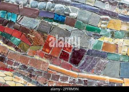 Colorful stone mosaic with chaotic pattern, seamless. Marble-stone mosaic texture. Stock Photo