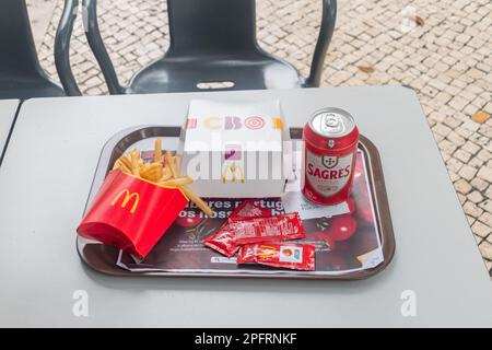 Lisbon, Portugal - December 3, 2022: McDonald's meal with french fries, CBO burger and Sagres beer in Portugal McDonald. Stock Photo