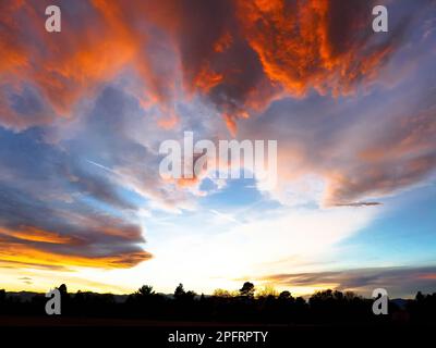 Colorful Colorado Sunset with distant dark horizon. Stock Photo
