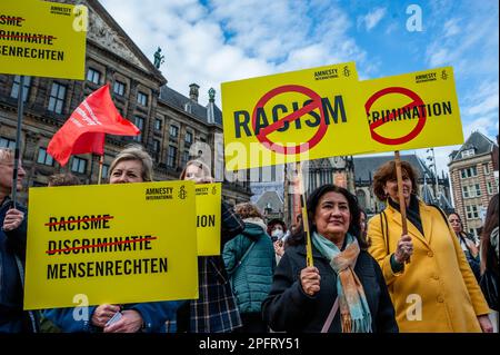 Amsterdam, Netherlands. 18th Mar, 2023. Protesters are seen holding placards during the demonstration. Activists and anti-racists gathered at the Dam square in Amsterdam to ask for diversity and solidarity, and to protest against all forms of racism and discrimination to mark the Elimination of Racial Discrimination day. Also, against the racism and discrimination that have become increasingly visible in Dutch official institutions. Credit: SOPA Images Limited/Alamy Live News Stock Photo