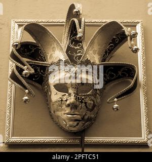 Traditional Venetian Mask on old wall background Stock Photo