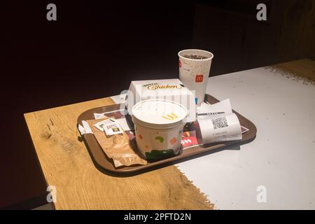 Lisbon, Portugal - December 5, 2022: McDonald meal with Rustic Chicken sandwich, bowl of soup and Coca-Cola in Portuguese McDonald's. Stock Photo