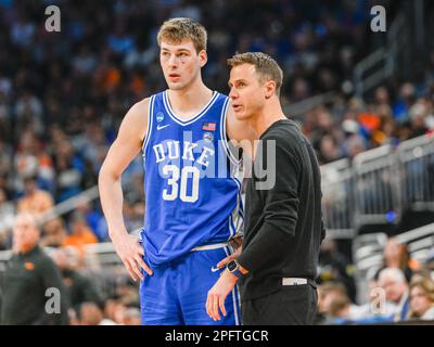 March 18, 2023: Duke head coach Jon Scheyer talks to Duke center Kyle Filipowski (30) during the 2nd half of a second-round college basketball game in the men's NCAA Tournament between Duke Blue Devils and Tennessee Volunteers. Tennessee defeated Duke 65-52 at Amway Center in Orlando, FL. Romeo T Guzman/CSM. Stock Photo