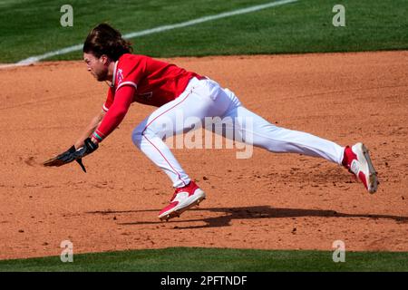 Los Angeles Angels' Brett Phillips fields a base hit by Texas Rangers'  Bubba Thompson during the xx inning of a spring training baseball game,  Saturday, March 18, 2023, in Tempe, Ariz. (AP