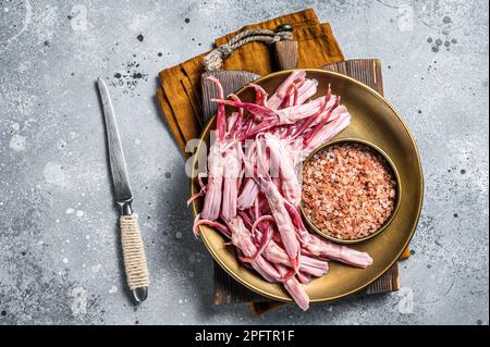 Fresh Raw Duck Tongue ready for cooking. Gray background. Top view. Stock Photo