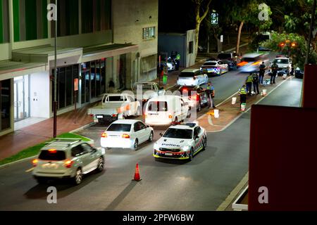 Police stop a woman in a car outside public housing towers on ...