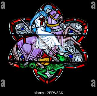 St. George, slaying Dragon, stained glass widow, by Frederick Preedy, 19th century, Old Hunstanton church, Norfolk, England Stock Photo