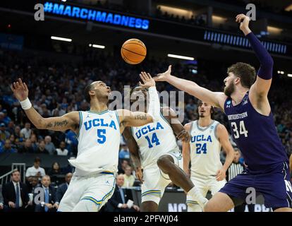 Sacramento, CA, USA. 18th Mar, 2023. UCLA Bruins guard Amari Bailey (5) and UCLA Bruins forward Kenneth Nwuba (14) battles for rebound with Northwestern Wildcats center Matthew Nicholson (34) during a game in the NCAA Tournament at Golden 1 Center in Sacramento, Saturday, March 18, 2023. Princeton Tigers beat the Missouri Tigers 78-63. (Credit Image: © Paul Kitagaki Jr./ZUMA Press Wire) EDITORIAL USAGE ONLY! Not for Commercial USAGE! Stock Photo