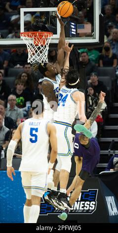 Sacramento, CA, USA. 18th Mar, 2023. UCLA Bruins forward Kenneth Nwuba (14) and UCLA Bruins guard Jaime Jaquez Jr. (24) defend against basket by Northwestern Wildcats guard Boo Buie (0) during a game in the NCAA Tournament at Golden 1 Center in Sacramento, Saturday, March 18, 2023. Princeton Tigers beat the Missouri Tigers 78-63. (Credit Image: © Paul Kitagaki Jr./ZUMA Press Wire) EDITORIAL USAGE ONLY! Not for Commercial USAGE! Stock Photo