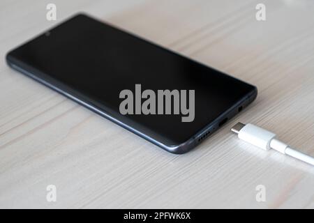 USB type C cable charger and port of the phone Stock Photo