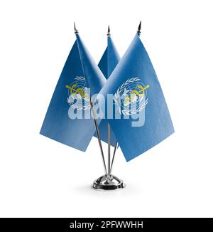 Small national flags of the World Health Organization WHO on a black ...
