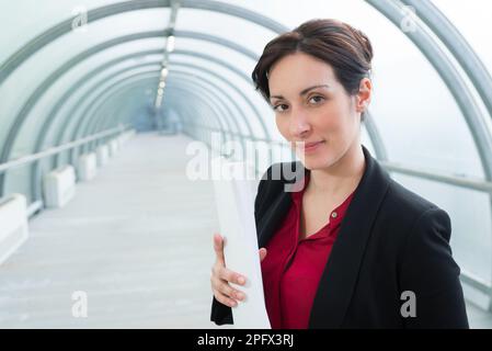 engineer woman working at site of bridge under construction Stock Photo