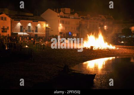 Celebrating San Juan on the beach.Bonfires are lit and Flaming Lanterns to mark the start of Summer Stock Photo