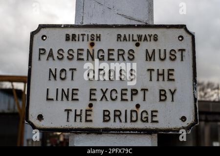 Passengers Must Not Cross The Line sign. Bury Bolton Street, East Lancs Railway. Stock Photo