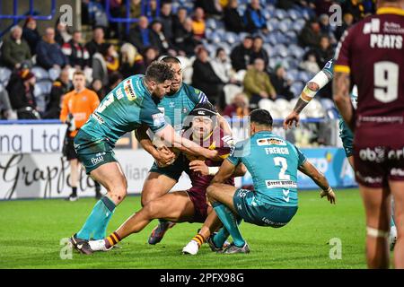 Huddersfield, England - 17th March 2023 - Esan Marsters (3) of Huddersfield Giants tackled. Rugby League Betfred Super League Round Five, Huddersfield Giants vs Wigan Warriors at John Smith's Stadium, Huddersfield, UK Stock Photo