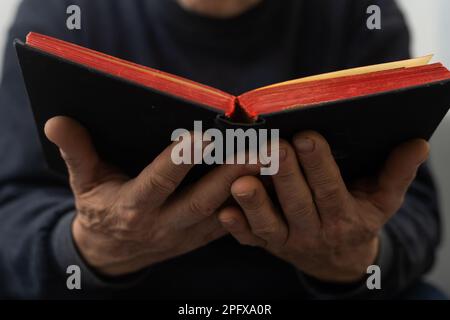 Hands of man praying to god with the bible, Concept of faith for god Stock Photo