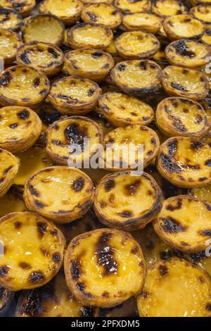 Traditional Portuguese dessert Pastle de Nata with custard on the counter Stock Photo