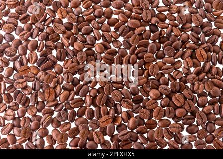 Textured background of roasted coffee beans, isolated on white with clipping path included Stock Photo