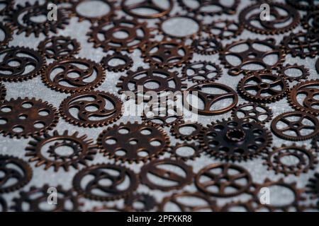 Lot of metal gears gray background Stock Photo