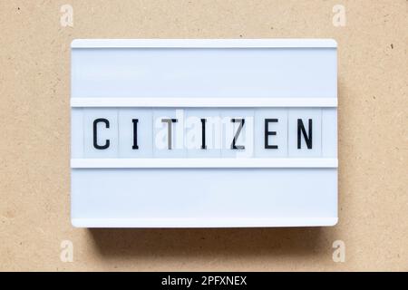 Lightbox with word citizen on wood background Stock Photo