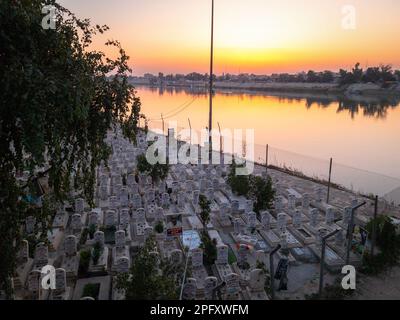 Baghdad, Iraq - Feb 28, 2023: Landscape Wide View of Al-Shuhadaa Cemetery Overlooking Tigris River in Adhamiya City, in which Martyrs of Civil War are Stock Photo