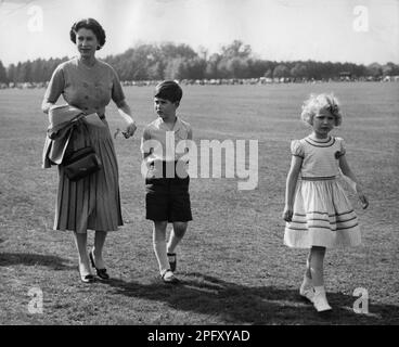 File photo dated 13/05/56 of Queen Elizabeth II with the then Prince Charles (now King Charles III) and the then Princess Anne (now the Princess Royal) during a break in the polo tournament, in which the Duke of Edinburgh was playing at Smith's Lawn in Windsor Great Park. The late Queen has been remembered by the King on the first Mother's Day since her death. A poignant message celebrating all mothers was posted online alongside treasured images which showed Charles as a beaming baby standing on the Queen's lap, while an adult Camilla is seen smiling as she stands behind her elderly mother Ro Stock Photo