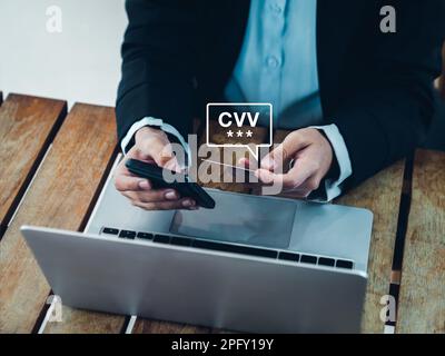 CVV code in speech bubble appears while businesswoman using smart phone and holding credit or debit card, paying for shopping online. Secure payment, Stock Photo