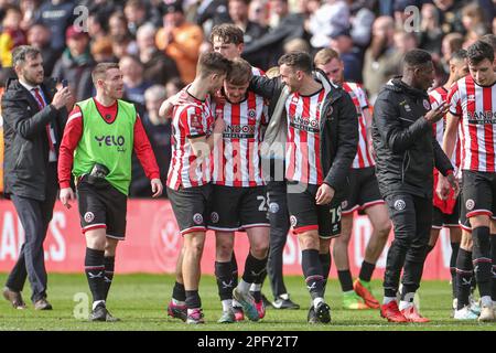 Goalscorer of the winning goal Tommy Doyle #22 of Sheffield United celebrates his teams win with teammates after the Emirates FA Cup Quarter-Finals Sheffield United vs Blackburn Rovers at Bramall Lane, Sheffield, United Kingdom, 19th March 2023  (Photo by Mark Cosgrove/News Images) Stock Photo