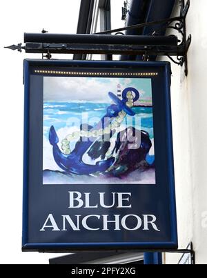 Traditional hanging pub sign at the Blue Anchor public house, Fore Street, Brixham, Devon , England, UK Stock Photo