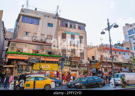 Amman, Jordan, 26 january 2023. Busy historical centre of Amman. People, yellow cabs and a lot of shops in local market. Stock Photo