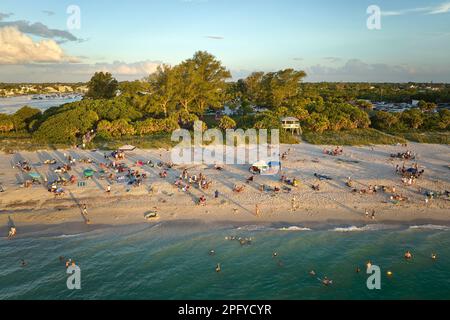 Aerial view of Nokomis beach in Sarasota County, USA. Many people enjoing vacation time swimming in gulf water and relaxing on warm Florida sun at Stock Photo