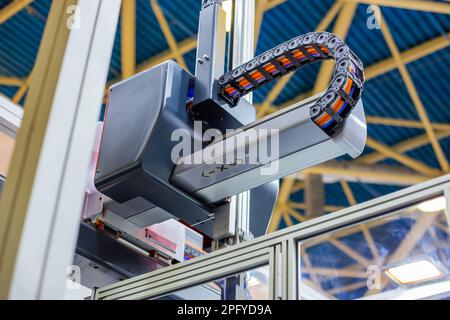 Upper part of plastic injection molding machine at exhibition Stock Photo