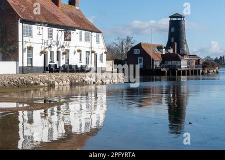 Langstone Harbour, view of the village, old mill and Royal Oak Pub on the seafront, Langstone, Hampshire, England, UK, on a sunny day Stock Photo