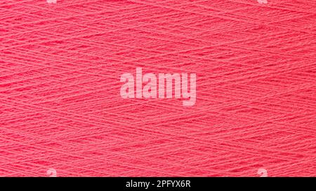 Close up texture picture of sew thread spool red color, macro background Stock Photo