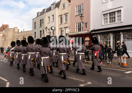 Windsor, Berkshire, England, UK. 2023.  Servicemen of the 1st Battalion Welsh Guards marching along the High Street and onto the castle for guard chan Stock Photo