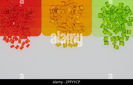 multicolored transparent plastic granulates with its color samples plates on white Stock Photo