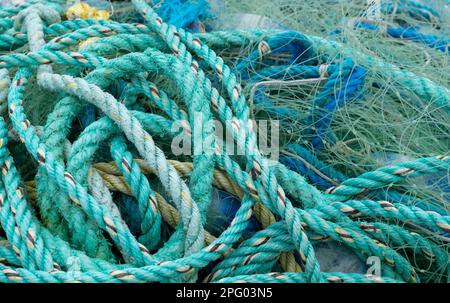 Turquoise fishing net and ropes, ship ropes, Portmaggee, Ireland Stock Photo