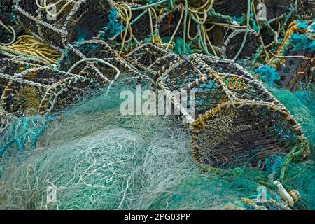 Turquoise fishing net and fish traps, Portmaggee, Ireland Stock Photo