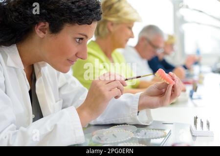 medical dentist experts in dental office working Stock Photo