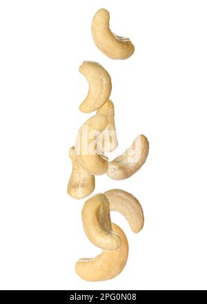Tasty raw cashew nuts falling on white background Stock Photo