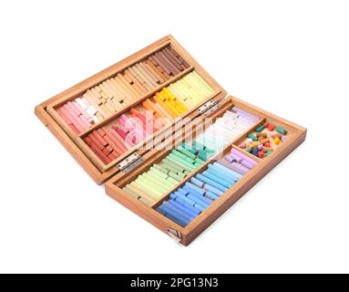 Set of soft pastels on white background in wooden box. Drawing material Stock Photo