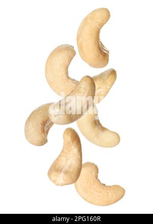 Tasty raw cashew nuts falling on white background Stock Photo