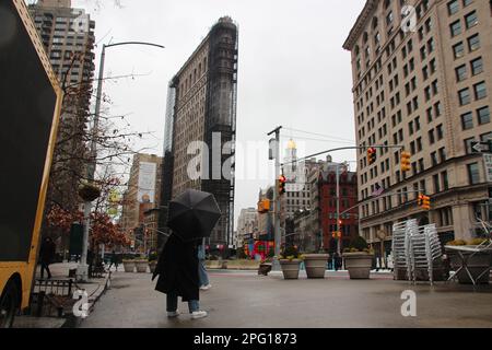 New York, USA. 14th Mar, 2023. The partially scaffolded Flatiron Building in Manhattan's Flatiron District, named after it. The triangular Flatiron Building is one of New York's most popular landmarks - but at the moment the famous 'iron building' is partially hidden behind scaffolding and completely empty inside. (to dpa: 'New York's famous 'Iron Building' to be auctioned off') Credit: Christina Horsten/dpa/Alamy Live News Stock Photo