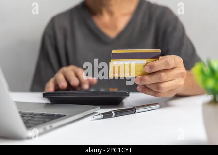 man using credit card for Online shopping, internet banking, store online, payment, spending money, e-commerce payment concept. Stock Photo