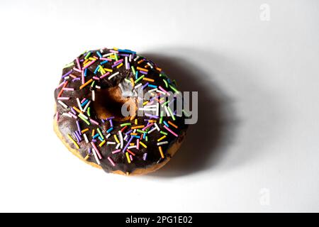 Colourful donuts on white background. Top view Stock Photo
