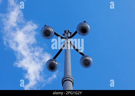 old metal street lamp with four lights Stock Photo