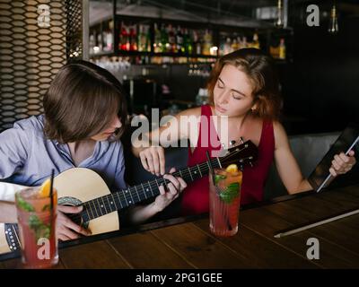 music tutor learn play guitar teaching Stock Photo