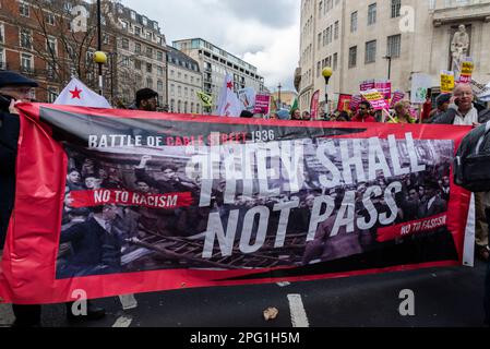 Protest taking place in London on UN Anti Racism Day. Stand up to Racism. Battle of Cable Street 1936 banner. They shall not pass Stock Photo