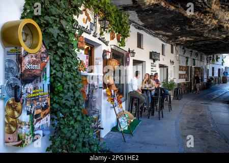 Bars and restaurants in La Cuevas de la sombra street, it is one of the most typical streets of Setenil de las Bodegas  Setenil de las Bodegas is a to Stock Photo