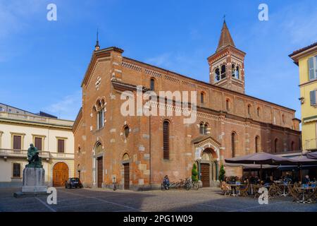 Monza, Italy - February 25, 2023: View of the San Pietro Martire church, with its piazza and visitors, in Monza, Lombardy, Northern Italy Stock Photo